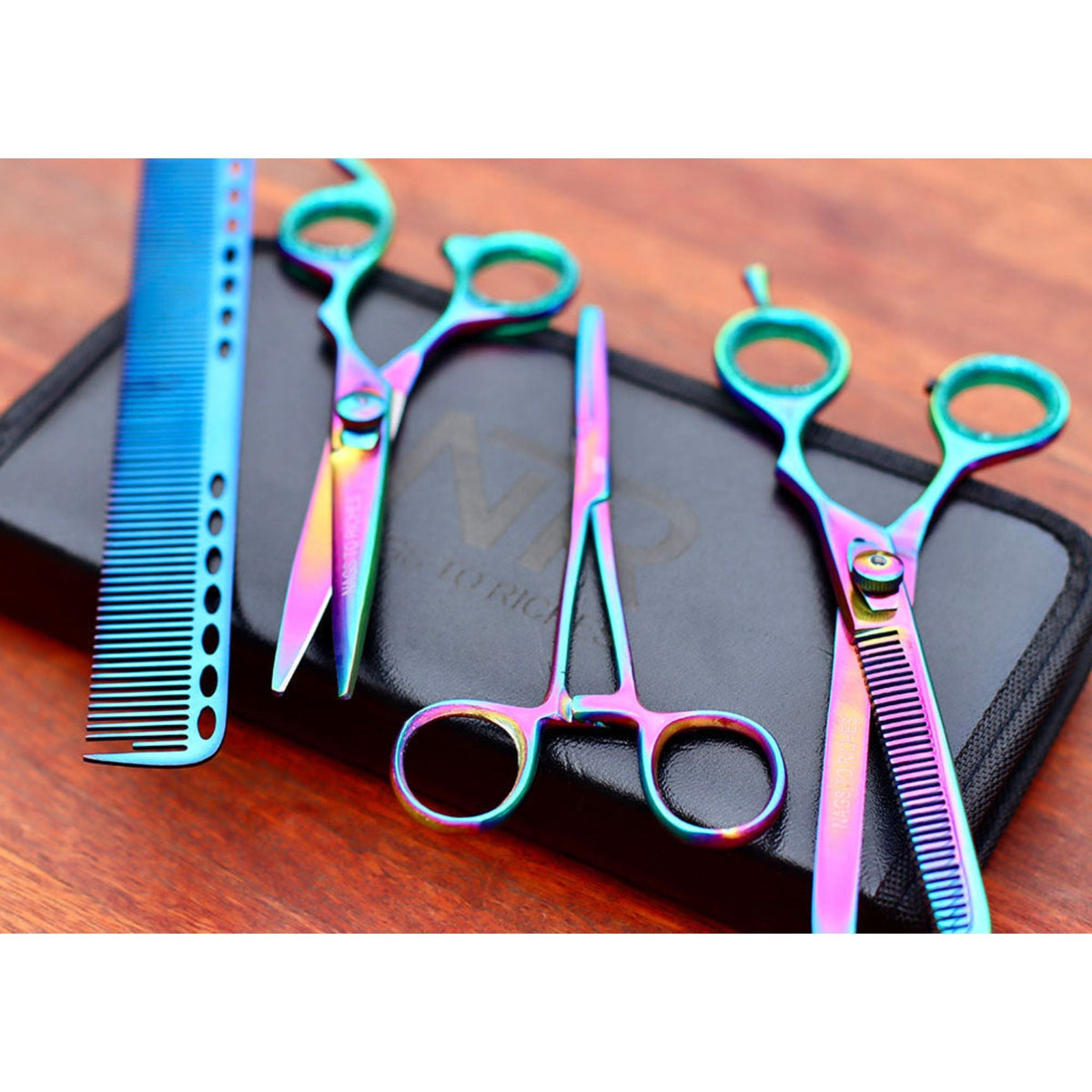 Four holographic equine mane and tail tools laid out on case.