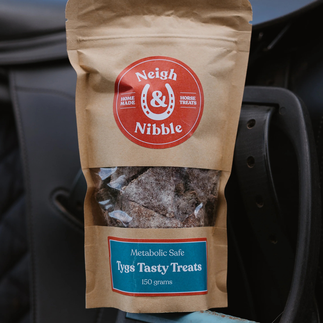 Neigh & Nibble horse treats, with a clear window showing the treats inside.  'Metabolic Safe Horse Treats 150 grams'.
